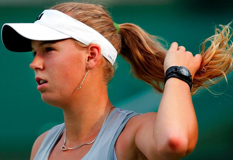 Lodtrækning. Caroline Wozniacki kommer på hårdt arbejde i sæsonfinalen i Qatar, men hun slipper i første omgang for at møde Williams-søstrene. 
