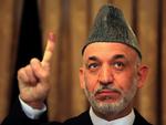 Vinder. Hamid Karzai fotograferet ved første runde af præsidentvalget, der var præget af udbredt valgsvindel. (Arkivfoto) 