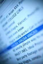 Headlines of spam messages on a computer screen