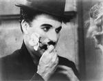 Chaplin med en rose i munden i filmen 'City Lights' fra 1931. 
