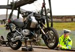 smadret. Carlo Cudicinis motorcykel bliver kørt væk fra ulykkesstedet. 