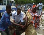 A wounded person being assisted   after the suicide bombing in Mogadishu last Thursday. 