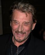 indlagt. Johnny Hallyday fotograferet på  den internationale filmfestival i Toronto. Hallyday har skrantet en del i år - samme måned, som fotoet er taget, september, blev han med succes opereret for kræft, og i sidste måned var han gennem en rygoperation. 