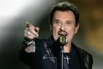Elvis-agtig. Johnny Hallydays koncerter bliver større med årene. Men han overrasker også med nye sange som ved uddelingen af årets musikpriser i Paris. Arkivfoto: Lionel Cironneau/AP 