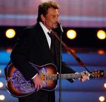 Rosckstar. 'Den franske Elvis', Johnny Hallyday, er for svag til at fortsætte sin turné. (arkivfoto) 
