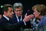 President Nicolas Sarkozy and Chancellor Angela Merkel in conversation at the COP15. 