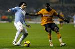 forskel. Carlos Tevez (tv) fra Manchester City scorede to gange uden at levere en af karrierens mest minderige indsatser mod bundholdet fra Wolverhampton, der til gengæld havde masser af spil uden at kunne omsætte det til mål. 