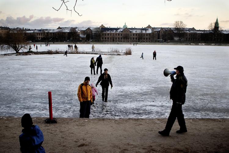 Police calling people off the ice in Copenhagen. 