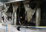 Brand. Tre kirker er blevet raseret af brandbomber i Malaysia. 