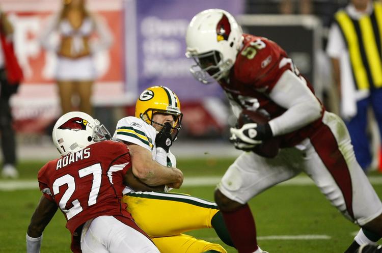 Afgørelsen. Karlos Dansby (til højre) sikrede Arizona sejren i overtiden. 