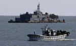Havgrænsestrid. Billedet er fra november i fjor og viser den sydkoreanske marinebase på en ø tæt ved det havområde, hvor der netop har været artilleribeskydninger. 