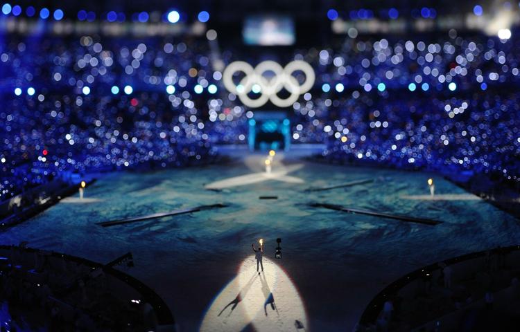 Den olympiske fakkel i centrum for begivenhederne. 