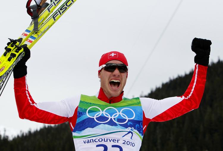 Triumf. Schweiziske Dario Cologna vandt olympiske guld, mens norske Petter Northug gik fuldkommen død. 