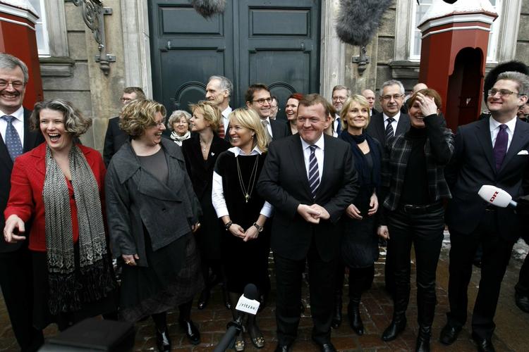 Prime Minister Lars Løkke Rasmussen's new cabinet emerging from the royal palace after being presented to Queen Margrethe II. 