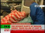 A woman is helped into an ambulance following Monday morning's attack in Moscow. 