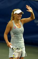 Farvel. Caroline Wozniacki kan nu koncentrere sig om singleturneringen i Charleston i South Carolina. Arkivfoto. 