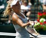 SKADET. Caroline Wozniacki havde sat næsen op efter en sejr, men måtte trække sig fra semifinalen i Charleston med en skade. 