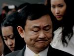 URO. Thailands tidligere premierminister Thaksin, der i dag lever i eksil, opfordrer den siddende regering til at gå af. Billedet her er fra 2008 