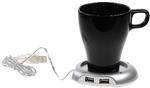 Hold Koppen varm.  Aldrig mere kold kaffe eller te! Stil kruset på kopvarmeren, og så skulle den kunne holde kaffen eller teen varm. Ud over at fungere som kopvarmer er dette også en såkaldt hub med fire USB-indgange, hvilket er praktisk, hvis du har for få ledige porte i computeren til alt det sjove grej, du vil tilslutte.  Kopvarmer, 114 kr. inkl. fragt. www.coolstuff.dk 
