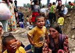 Uzbek refugees waiting to cross the border into Uzbekistan as a result of fighting in Osh. 