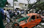 Pakistani security officials and journalists gather at the site of a bomb explosion outside the Danish Embassy in Islamabad on Monday, June 2, 2008. Archive. 