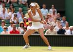CENTRUM. Caroline Wozniacki får under Wimbledon fuld opmærksomhed af både mor og far. 