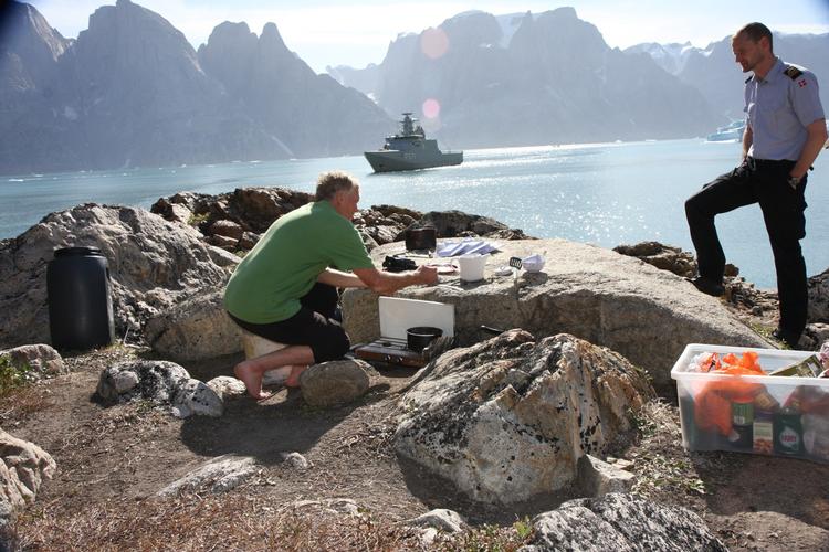 Greg Mortimer with Danish First Lieutenant Morten Brandt the day before the Australian's accident. The vessel in the background is the Danish inspection vessel Ejnar Mikkelsen. 