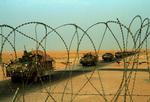 Afsked. De sidste amerikanske kamptropper krydser grænsen fra Irak til Kuwait i nat dansk tid - tidligt i morges lokal tid. 