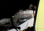 A rescued man is brought into an ambulance near Mandal, Norway  late Wednesday in Norway. Four people are missing and two were rescued when a boat capsized in the sea south east of Mandal 