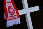 gældsinddrivelse. Et mindeområde til ære for de mange døde ved Hillsborough-ulykken er placeret uden for Liverpool FC's stadion Anfield. Arkivfoto. 