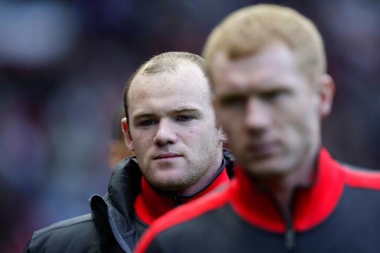 exit. Wayne Rooney (bagerst) meldes på vej væk fra Manchester United. 
