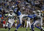 uheldige. Detroit Lions Nate Burleson (13) griber bolden i kampen mod New York Jets. 