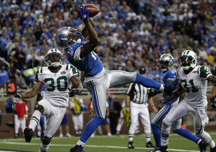 uheldige. Detroit Lions Nate Burleson (13) griber bolden i kampen mod New York Jets. 