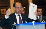 Afstemning. Nuri al-Maliki stemmer ved valget i marts. Siden da har Irak været uden regering. 