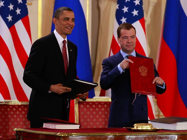 START. President Barack Obama holds the signed New START treaty with Russian president Dmitry Medvedev at the Prague Castle in Prague Thursday, April 8, 2010. 