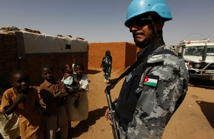 Sudan. A Jordanian peacekeeper of the United Nations African Mission In Darfur, UNAMID patrols the refugee camp of Abou Shouk at the outskirts of the Darfur town of el Fasher, Sudan Wednesday, April 14, 2010. 