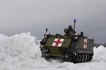 Redningen. Hjemmeværnets PMV M113 A1 SAN i udkanten af Rønne. PMV'en har været kaldt ud 25 gange siden den 23. december. Ole Andreasen er kører og Michael Mortensen er vognkommandør. 