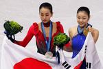 medaljekandidater. Yu-na Kim (t.v.) og Mao Asada side om side ved årets OL i Vancouver. 