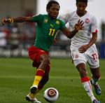 drama. To gange var Tunesien foran, men Jean Makoun (tv.) og de øvrige fra Cameroun gik videre med 2-2 mod Issam Jemaa og co. 