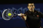 ubesværet. En af favoritterne til titlen, Novak Djokovic, kom let gennem første runde ved Australia Open og skal nu møde kroaten Ivan Dodig. 