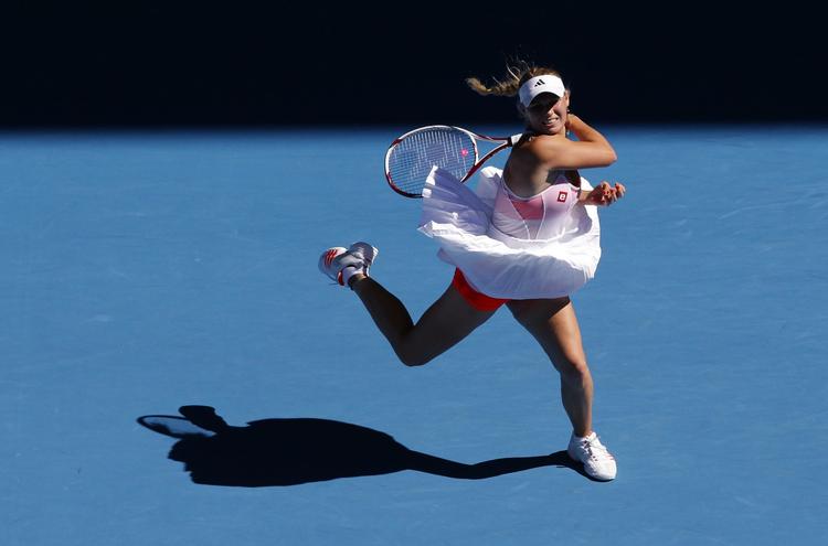 ballerina. Caroline Wozniacki slog næsten ingen vinderslag mod Li Na, mens kineseren bed sig fast i kampen og satsede trods modgang. 