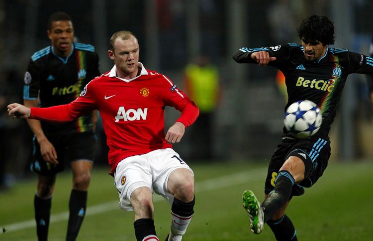 Nulløsning. Hvis Marseille og Lucho Gonzalez (t.h.) scorer en gang på Old Trafford, så skal Wayne Rooney og United score to gange for at gå videre. 