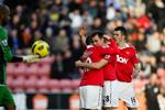 4-0. Wayne Rooney fejrer sin scoring mod Wigan sammen med holdkammeraterne. 
