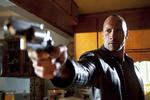 Fåmælt. Man skal ikke se 'Faster' for replikkernes skyld: Dwayne 'The Rock' Johnsons ordknaphed får vor egen Mads Mikkelsen til at ligne en ordekvilibrist. Foto: Sony Pictures 