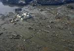 Hærget. Minamisanriku efter at den er blevet ramt af den ti meter høje tsunami-bølge i går. 