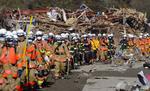 Brandmænd på vej til oprydninig i Rikuzentakata. 