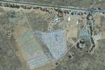 Dette sattellitbillede fra GeoEye viser den tunesiske teltlejr ved Ras Adjir nær den libyske grænse. Teltlejren kan huse 20.000 mennesker. 