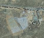 Dette sattellitbillede fra GeoEye viser den tunesiske teltlejr ved Ras Adjir nær den libyske grænse. Teltlejren kan huse 20.000 mennesker. 