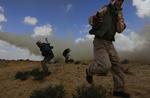 Bykrig. Der kæmpes hårdt om de libyske byer. Misrata er under hård beskydning af Gaddafis styrker, og ved Brega (billedet) er kampene også intense. 
