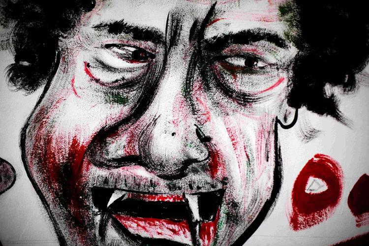 Upopulær. Moamar Gaddafi portrætteret på en mur i Benghazi. 